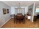 Bright dining area features a table, and an adjacent dry bar perfect for entertaining guests at 13211 Asbury Chapel Rd, Huntersville, NC 28078