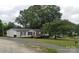 Charming single-story home with a cozy front porch and well-maintained lawn at 13211 Asbury Chapel Rd, Huntersville, NC 28078