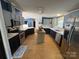 Spacious kitchen with stainless steel appliances, a center island, and abundant countertop space at 13211 Asbury Chapel Rd, Huntersville, NC 28078