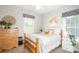 This bedroom features a full bed, wooden furniture, a ceiling fan, and great natural light at 133 Upland Dr, Statesville, NC 28625