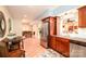 Well-equipped kitchen area with stainless steel appliances, wooden cabinets, and adjacent dining space, great for entertaining at 133 Upland Dr, Statesville, NC 28625
