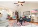 Bright living room features vaulted ceilings, a ceiling fan, a colorful rug, and comfortable seating at 133 Upland Dr, Statesville, NC 28625
