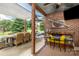 Outdoor patio with shaded dining area and brickwork, perfect for enjoying al fresco meals and outdoor gatherings at 133 Upland Dr, Statesville, NC 28625