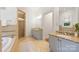 Bathroom featuring a tub, shower, double vanity, granite countertop, and tiled floors at 1417 The Plz, Charlotte, NC 28205