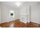 Bedroom with a brick fireplace and natural light at 1417 The Plz, Charlotte, NC 28205