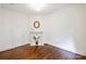 Cozy bedroom boasts hardwood floors, fresh white walls, a decorative fireplace, and ample space at 1417 The Plz, Charlotte, NC 28205