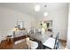 Bright dining room with wooden table, modern decor, hardwood floors, and neutral tones at 1417 The Plz, Charlotte, NC 28205