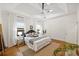 Bright and airy main bedroom with lots of natural light, a modern light fixture, and stylish decor at 1417 The Plz, Charlotte, NC 28205