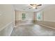 Spacious bedroom with neutral walls, carpet, ample natural light, and a ceiling fan at 1517 E Barden Rd, Charlotte, NC 28226