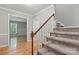 Inviting entryway with hardwood floors and carpeted stairs at 1517 E Barden Rd, Charlotte, NC 28226