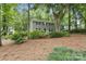 Beautiful two-story home with mature trees and lush landscaping at 1517 E Barden Rd, Charlotte, NC 28226