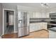Kitchen featuring stainless steel refrigerator and plenty of cabinet space at 1517 E Barden Rd, Charlotte, NC 28226