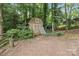 View of a storage shed on a partially wooded lot at 1517 E Barden Rd, Charlotte, NC 28226