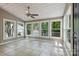 Bright sunroom surrounded by windows and tile flooring at 1517 E Barden Rd, Charlotte, NC 28226