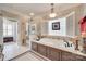 Luxurious bathroom with a jetted tub, glass-enclosed shower, and beige tiling at 16527 Woolwine Rd, Charlotte, NC 28278