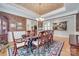 Elegant dining room featuring a chandelier, an area rug, and a wooden dining table at 16527 Woolwine Rd, Charlotte, NC 28278