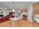 Open kitchen with a granite island, stainless steel refrigerator, and a view into the living room at 16527 Woolwine Rd, Charlotte, NC 28278