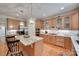 Elegant kitchen with a granite island, stainless steel appliances, and hardwood floors at 16527 Woolwine Rd, Charlotte, NC 28278
