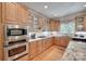 Modern kitchen with updated appliances, stylish cabinetry, and granite countertops at 16527 Woolwine Rd, Charlotte, NC 28278