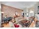 Spacious living room featuring a piano, fireplace, hardwood floors, and elegant decor at 16527 Woolwine Rd, Charlotte, NC 28278