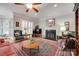 Comfortable living room with a fireplace, TV, and inviting seating for relaxation at 16527 Woolwine Rd, Charlotte, NC 28278
