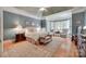 Spacious main bedroom with a bay window, carpeting, and a sitting area at 16527 Woolwine Rd, Charlotte, NC 28278
