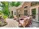 Beautiful outdoor deck area with seating, plants, and charming fountains for outdoor enjoyment at 16527 Woolwine Rd, Charlotte, NC 28278