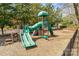 Neighborhood playground area with slides, climbing structures, and swings set in a secure, fenced-in setting at 16527 Woolwine Rd, Charlotte, NC 28278
