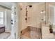 Modern glass-enclosed shower with a rain shower head and mosaic-tiled floor at 16527 Woolwine Rd, Charlotte, NC 28278