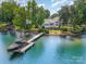 Aerial view of the house showcasing the boat dock and lakefront property at 17719 Springwinds Dr, Cornelius, NC 28031