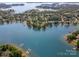 Beautiful aerial view of lakeside homes and docks along a lake at 17719 Springwinds Dr, Cornelius, NC 28031