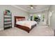 Spacious bedroom with a large window overlooking a nice view and a ceiling fan above the bed at 17719 Springwinds Dr, Cornelius, NC 28031