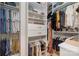 Walk-in closet with shelving, hanging rods, and custom storage solutions at 17719 Springwinds Dr, Cornelius, NC 28031