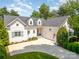 Charming home with a well-manicured lawn and a classic exterior, complete with an attached garage at 17719 Springwinds Dr, Cornelius, NC 28031