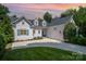 Charming home with a well-manicured lawn and a classic exterior, complete with an attached garage at 17719 Springwinds Dr, Cornelius, NC 28031