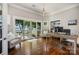 Office featuring views of the lake, built in shelving, a pendant light, and access to the deck at 17719 Springwinds Dr, Cornelius, NC 28031