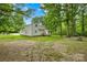 Spacious backyard with trees and a home featuring a backyard deck at 221 Reliance Rd, Kings Mountain, NC 28086