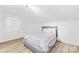 Charming bedroom with a queen bed, soft gray and white decor and natural light from a window at 221 Reliance Rd, Kings Mountain, NC 28086