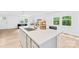 Open concept kitchen with a center island, quartz countertop, stainless steel faucet and bright natural lighting at 221 Reliance Rd, Kings Mountain, NC 28086