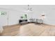 Bright living room with modern floors, neutral walls, and a comfortable sectional sofa at 221 Reliance Rd, Kings Mountain, NC 28086