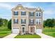 Charming attached two-story homes boasting manicured lawns and individual garages in a suburban setting at 2342 Nadine Ln, Charlotte, NC 28216