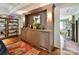 Stylish bar area featuring custom cabinetry, elegant lighting, and ample storage space at 2526 Sherwood Ave, Charlotte, NC 28207