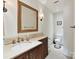 Bathroom featuring a decorative mirror, vanity, and updated fixtures at 2526 Sherwood Ave, Charlotte, NC 28207