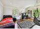 Bedroom with a cozy hammock, desk, and a large window with lots of natural light at 2526 Sherwood Ave, Charlotte, NC 28207