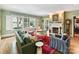 Bright living room with hardwood floors, shuttered windows, and fireplace at 2526 Sherwood Ave, Charlotte, NC 28207