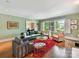 Elegant living room featuring hardwood floors, large windows, and ample seating at 2526 Sherwood Ave, Charlotte, NC 28207