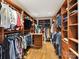 Large walk-in closet with custom shelving and hanging racks at 2526 Sherwood Ave, Charlotte, NC 28207