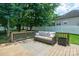 Relaxing back deck featuring a cozy sofa and tranquil setting, ideal for unwinding after a long day at 2908 Barnard Castle Ln, Matthews, NC 28104