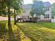 Expansive backyard featuring a wooden deck, lush greenery, and privacy fencing for outdoor enjoyment at 2908 Barnard Castle Ln, Matthews, NC 28104