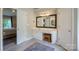 Bathroom featuring a vanity with cabinets, a large mirror, and tiled floors at 2908 Barnard Castle Ln, Matthews, NC 28104